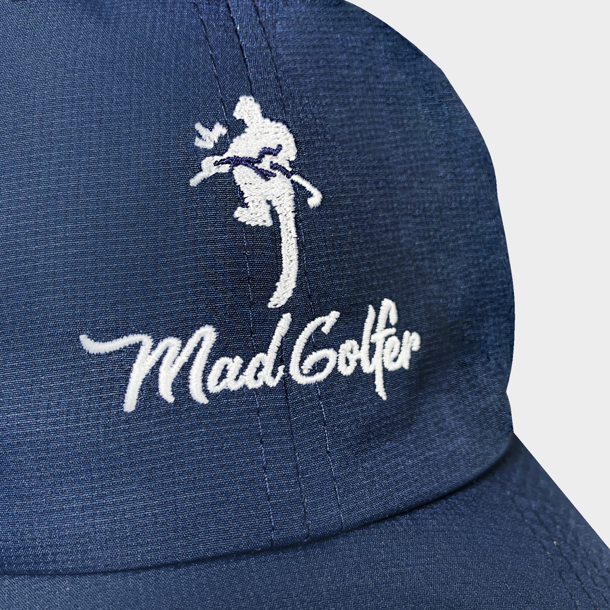 navy blue MadGolfer baseball hat with classic old-school design and logo close-up